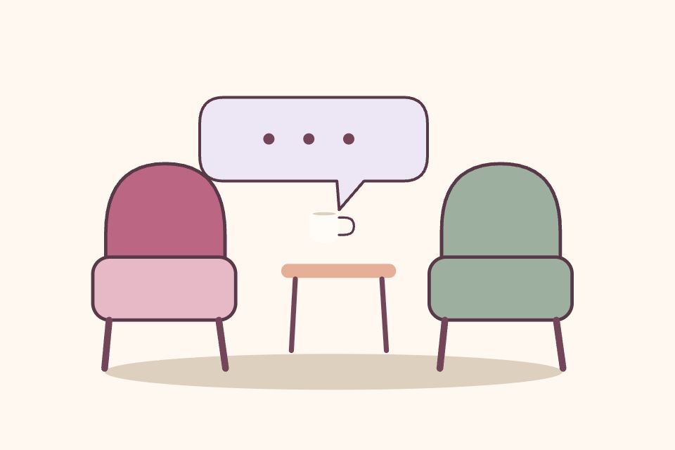 Dos sillones distintos junto a una mesa y una taza; un globo con puntos representa una conversación tranquila.